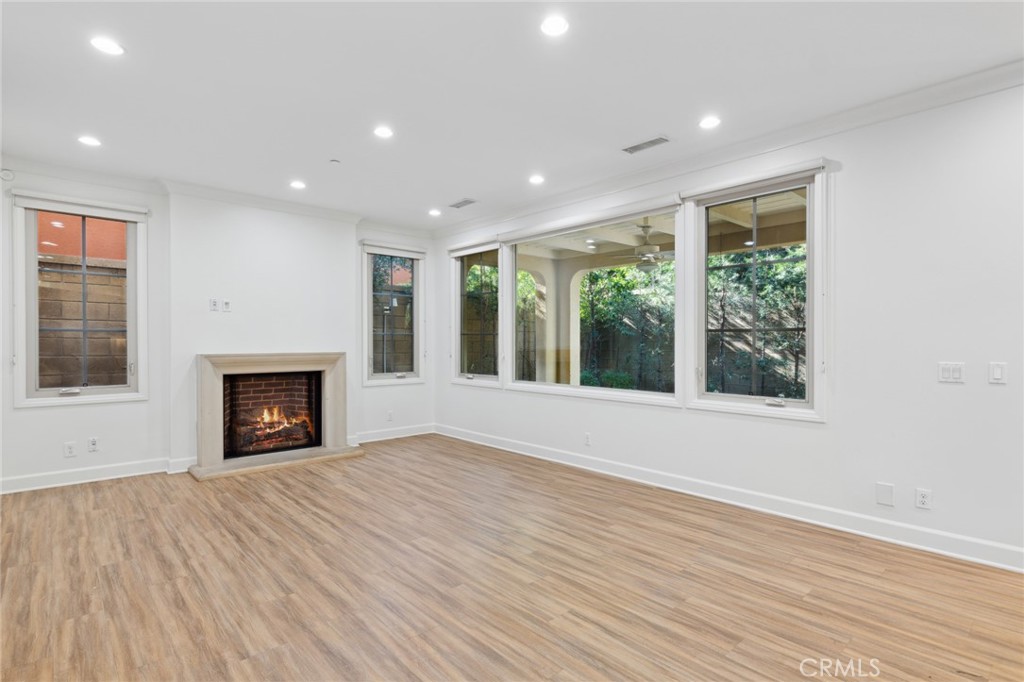 40 Lupari Irvine, CA 92618 - Photo 3 of 56 a view of an empty room with a window and fireplace