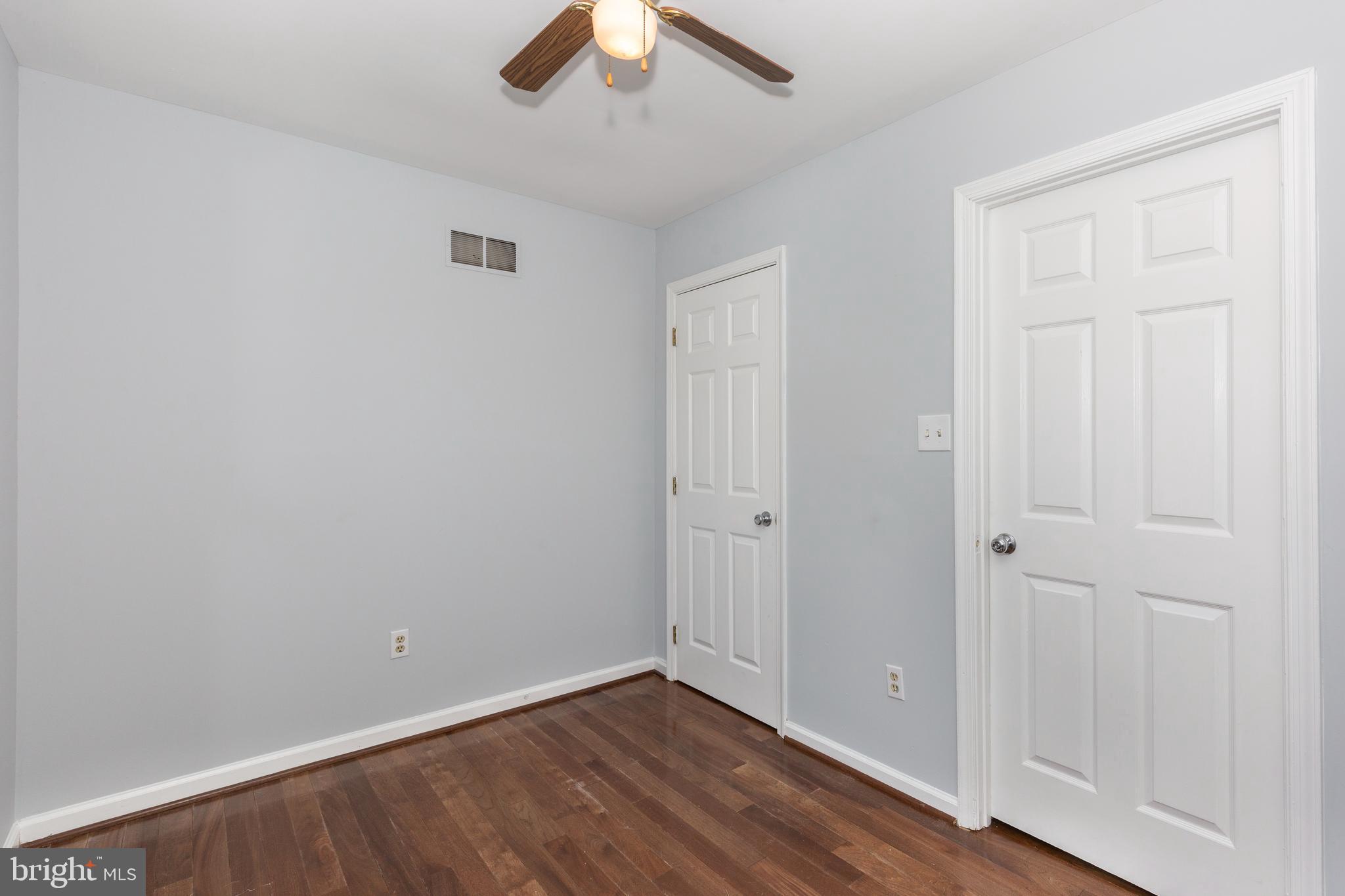 703 Uniontown Road Westminster, MD 21158 - Photo 14 of 42 wooden floor in an empty room