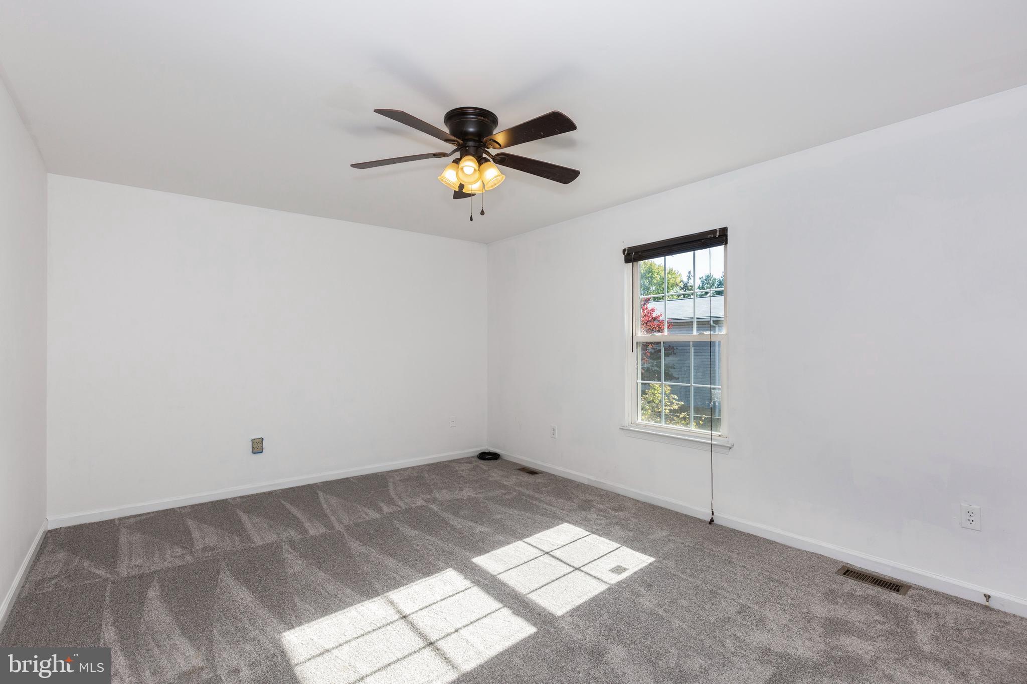 703 Uniontown Road Westminster, MD 21158 - Photo 18 of 42 a view of room with a ceiling fan and window