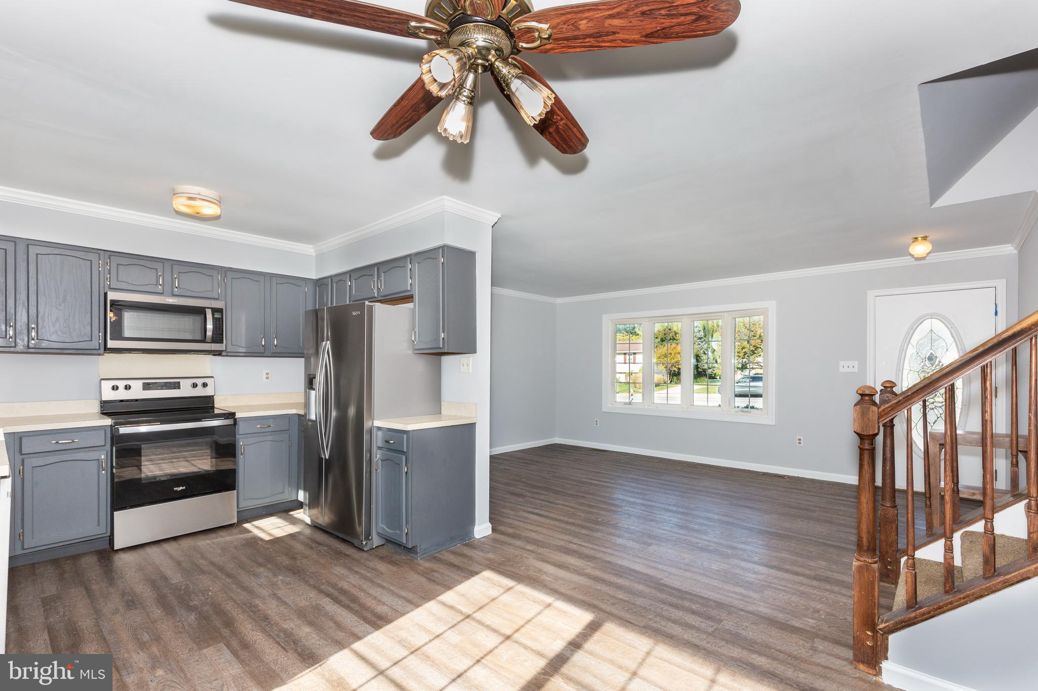 703 Uniontown Road Westminster, MD 21158 - Photo 2 of 42 a kitchen with stainless steel appliances granite countertop a refrigerator and a stove top oven