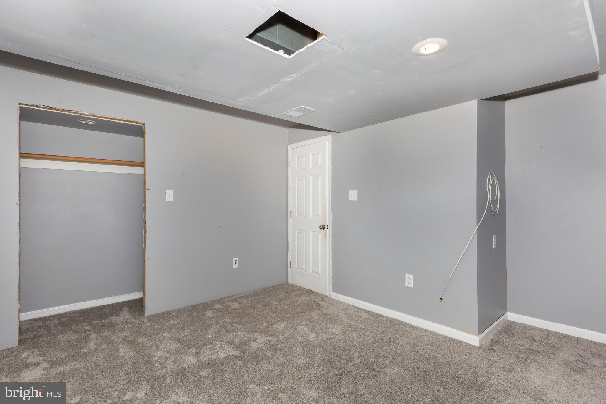 703 Uniontown Road Westminster, MD 21158 - Photo 38 of 42 an empty room with closet and windows