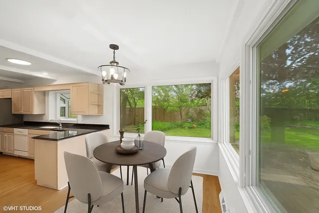 a view of a dining room with furniture window and outside view