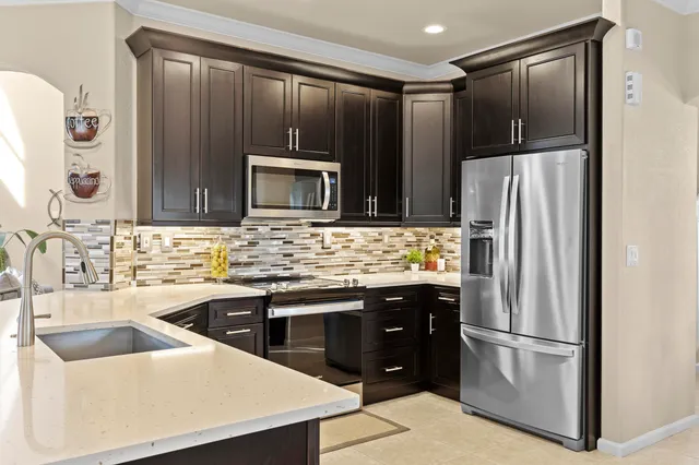 a view of a dining room and a table chairs