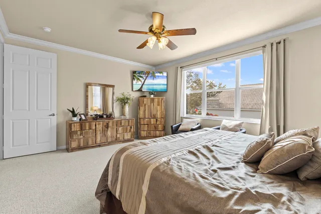 a bedroom with a bed and a dresser