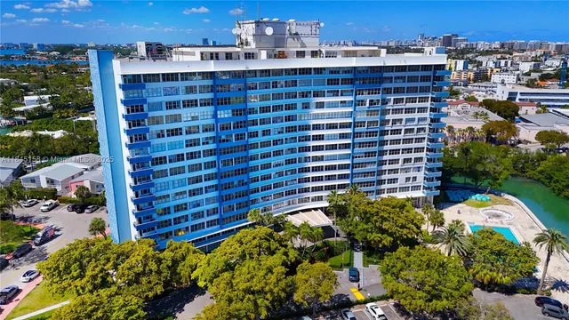 an aerial view of a city with lake view