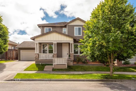 a view of a house with a yard patio and yard