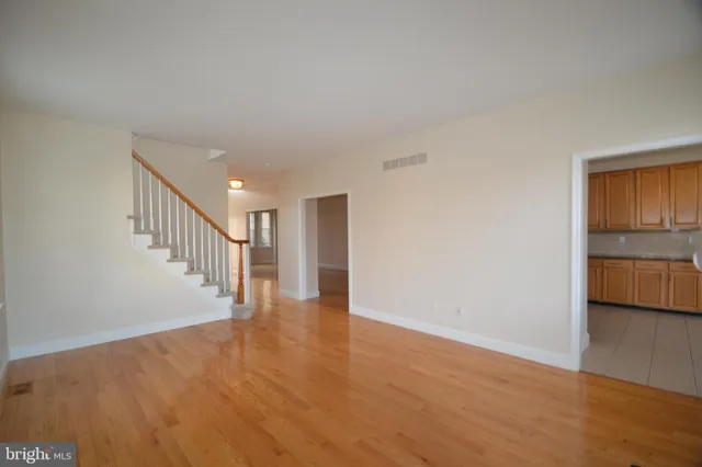 a view of an entryway with wooden floor