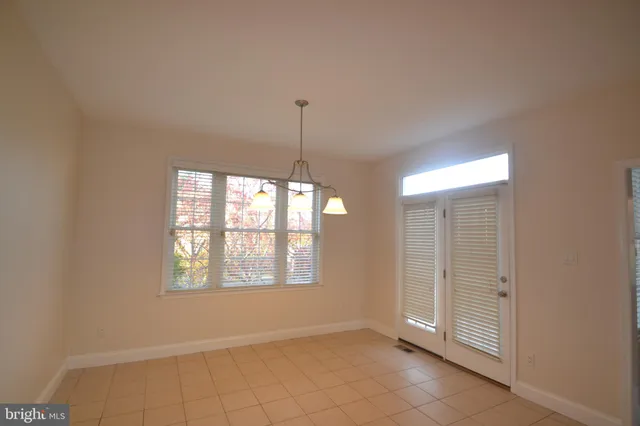 a view of an empty room with windows