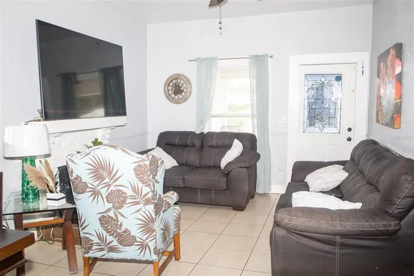 a living room with furniture and a flat screen tv
