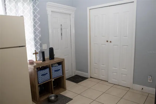 a view of storage and utility room with closet