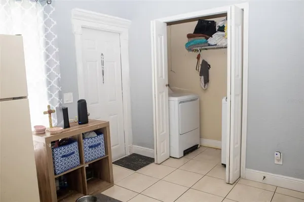 a view of a hallway with front door and stairs