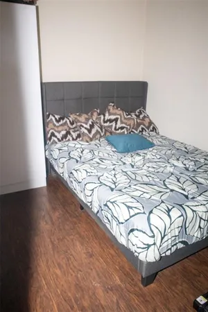 a view of a bedroom with a bed