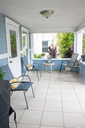 a living room with patio furniture