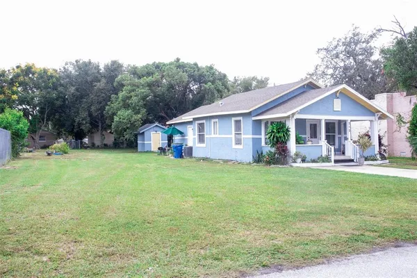 a view of a house with a yard