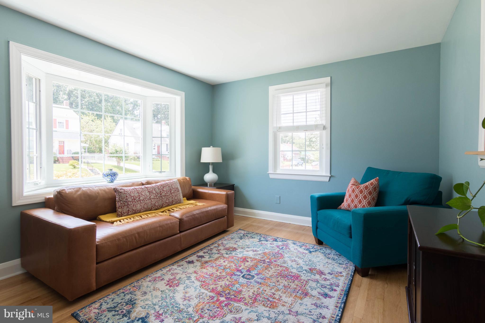 1234 Oakland Terrace Road Baltimore, MD 21227 - Photo 2 of 30 a living room with furniture and a window
