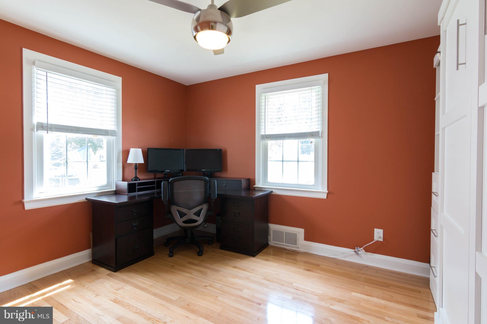 1234 Oakland Terrace Road Baltimore, MD 21227 - Photo 11 of 30 a view of workspace with wooden floor and windows