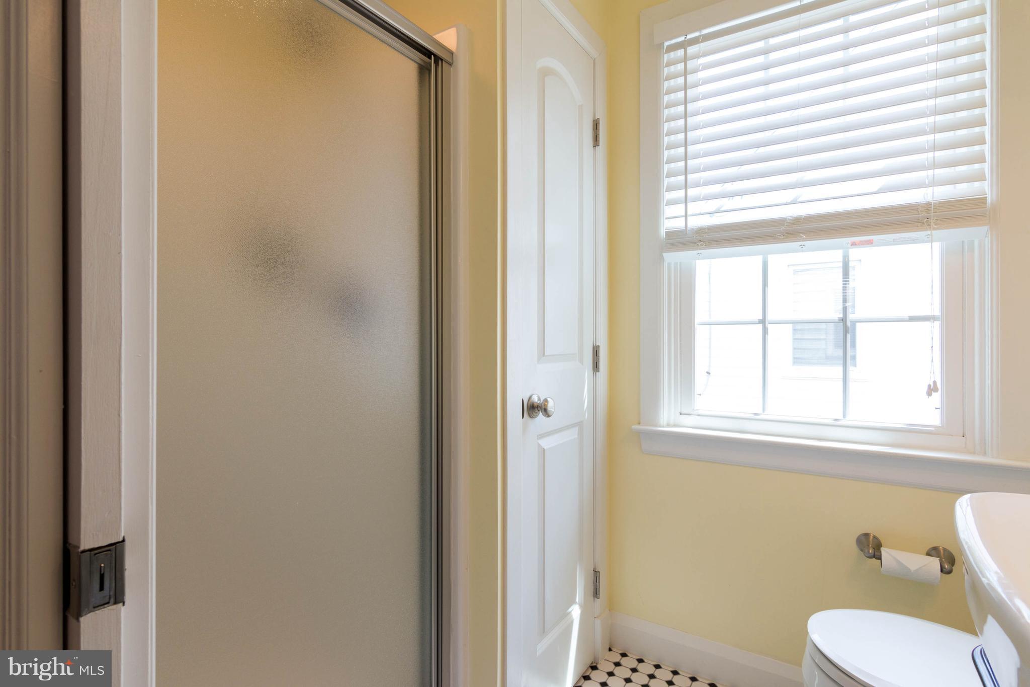 1234 Oakland Terrace Road Baltimore, MD 21227 - Photo 14 of 30 a white toilet sitting next to a bathroom sink