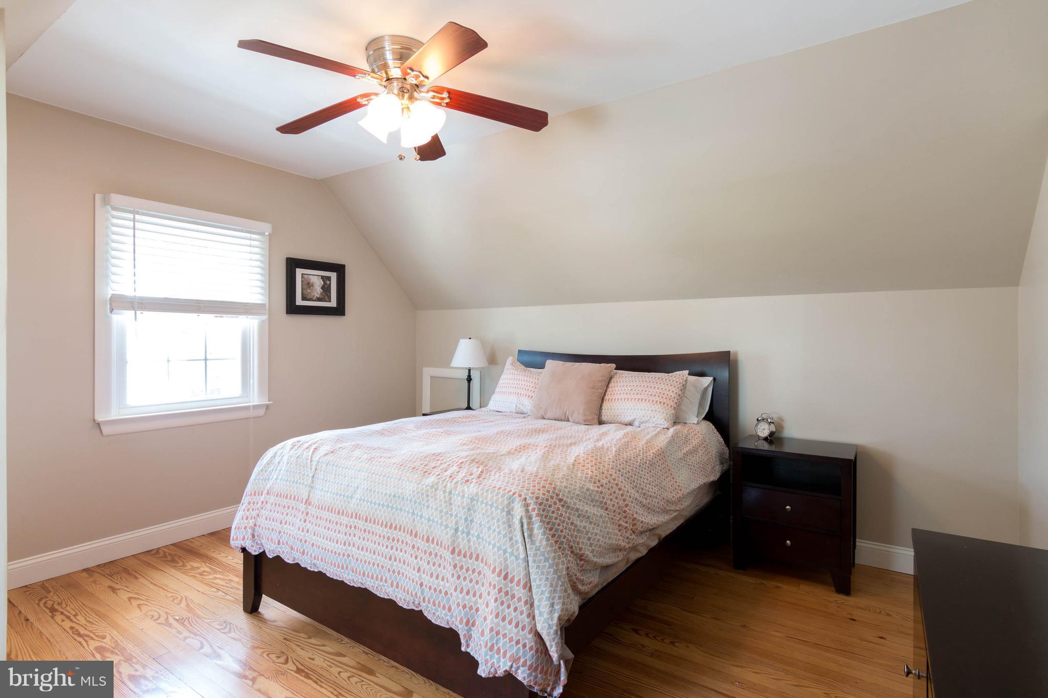 1234 Oakland Terrace Road Baltimore, MD 21227 - Photo 15 of 30 a bedroom with bed and a window