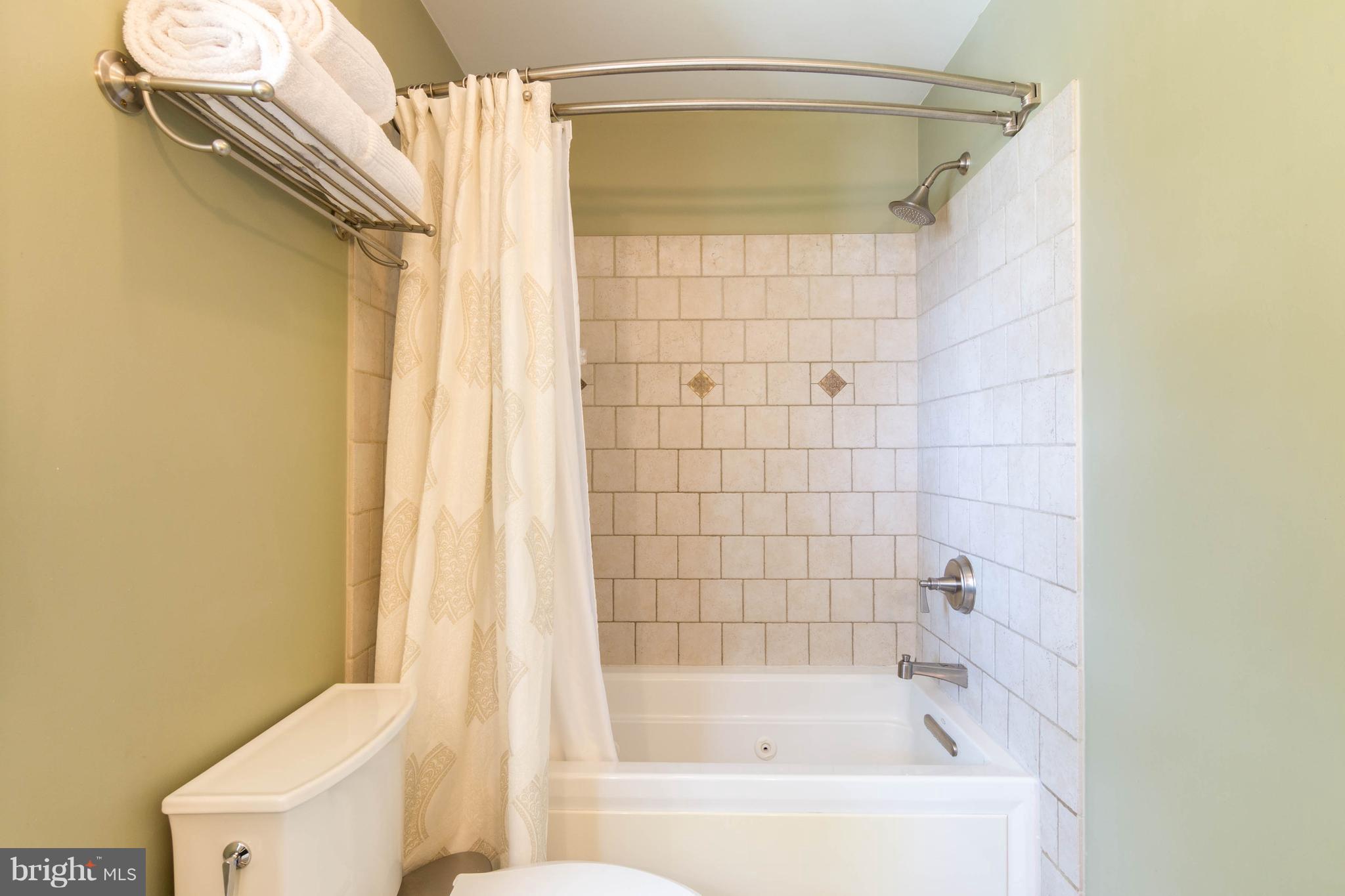 1234 Oakland Terrace Road Baltimore, MD 21227 - Photo 19 of 30 a bathroom with a shower and a toilet