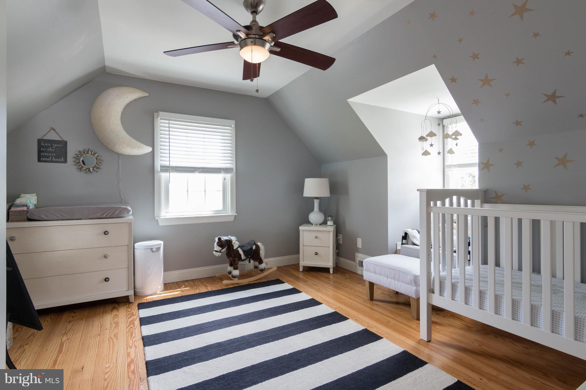 1234 Oakland Terrace Road Baltimore, MD 21227 - Photo 20 of 30 a bedroom with a bed and a chandelier fan
