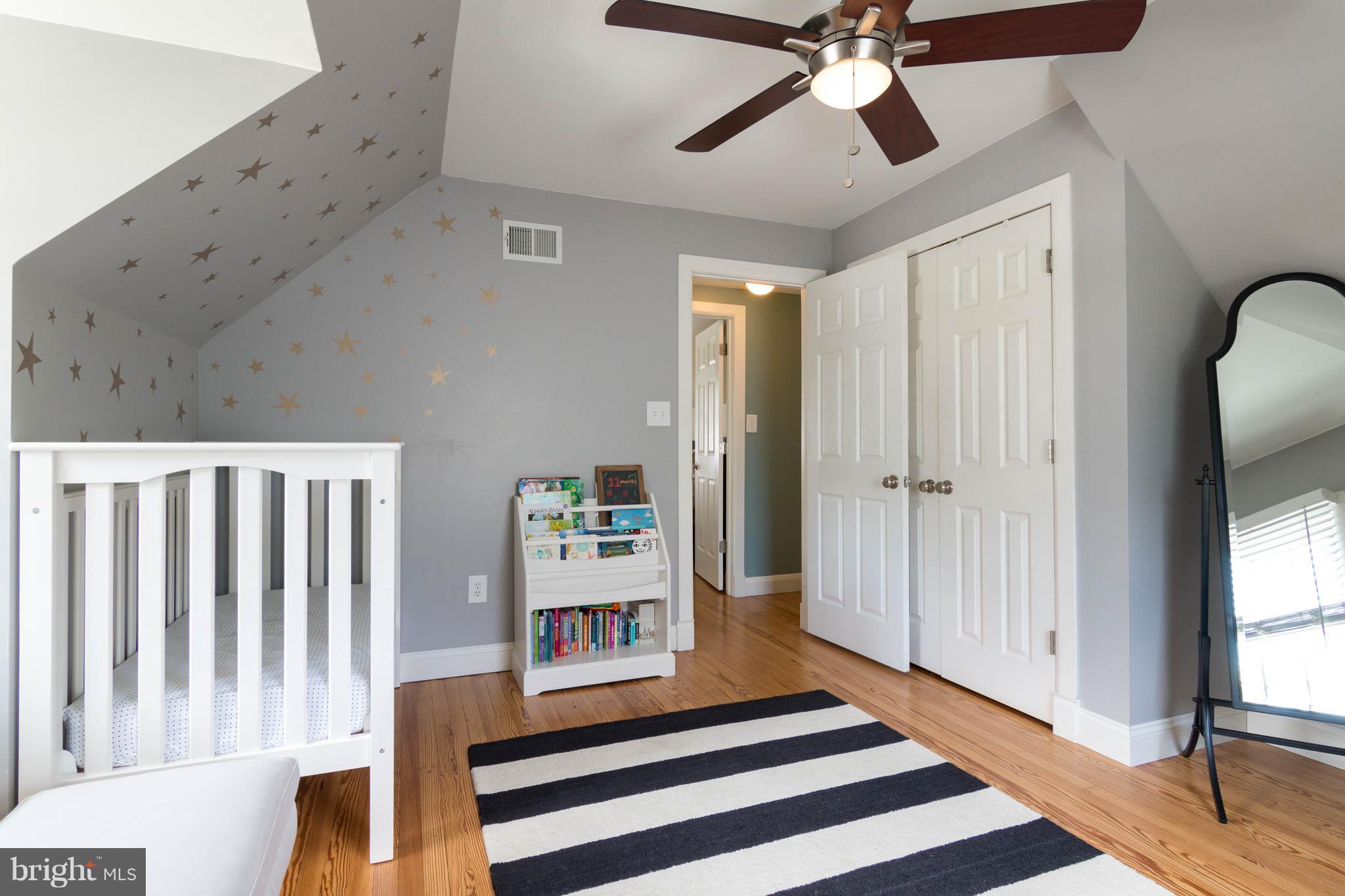 1234 Oakland Terrace Road Baltimore, MD 21227 - Photo 21 of 30 a living room with wooden floor and a ceiling fan