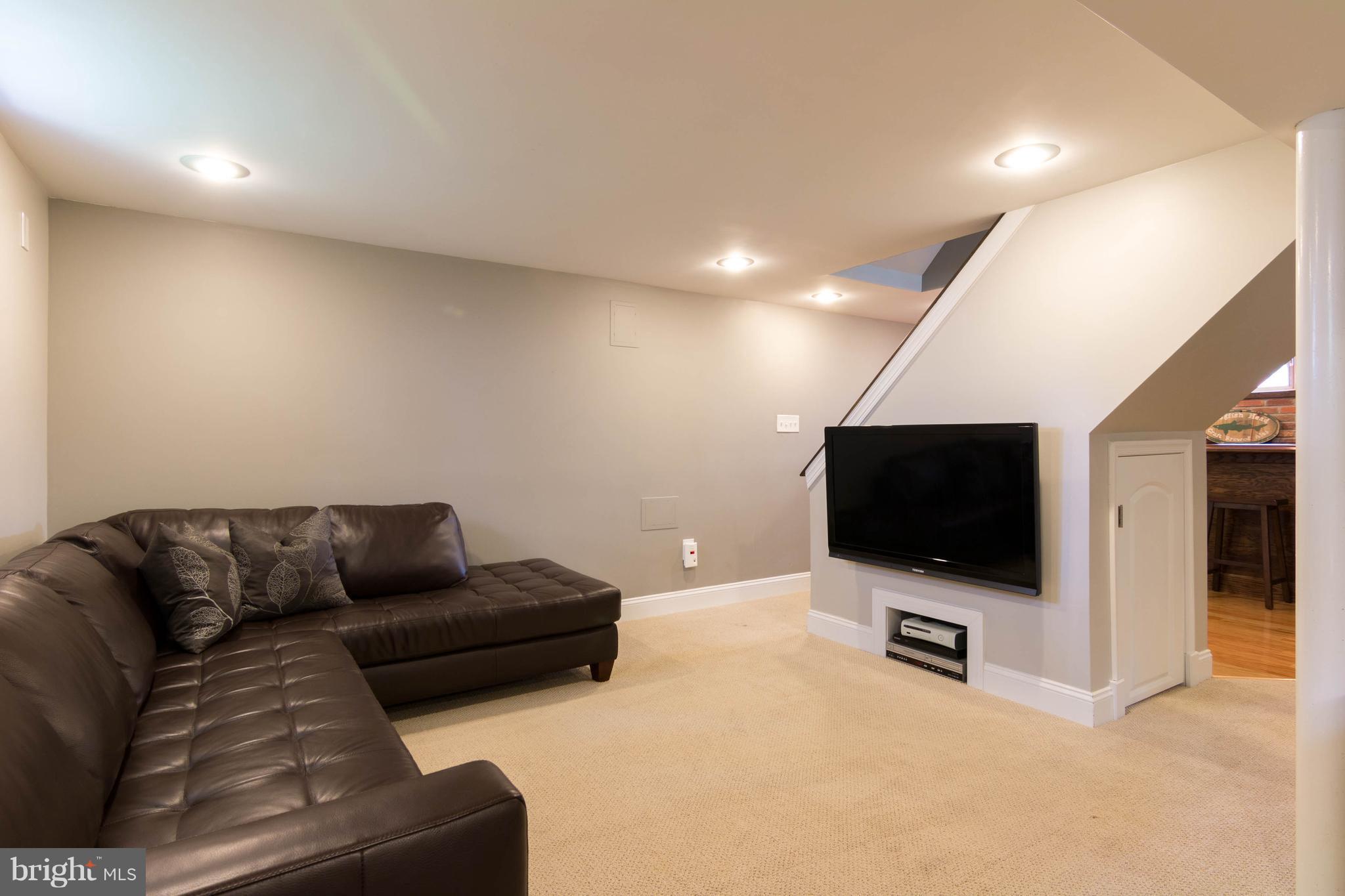 1234 Oakland Terrace Road Baltimore, MD 21227 - Photo 24 of 30 a living room with furniture and a flat screen tv