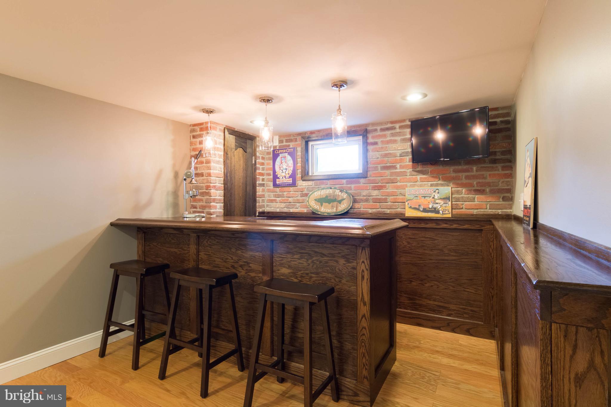 1234 Oakland Terrace Road Baltimore, MD 21227 - Photo 25 of 30 a kitchen with a sink cabinets and wooden floor