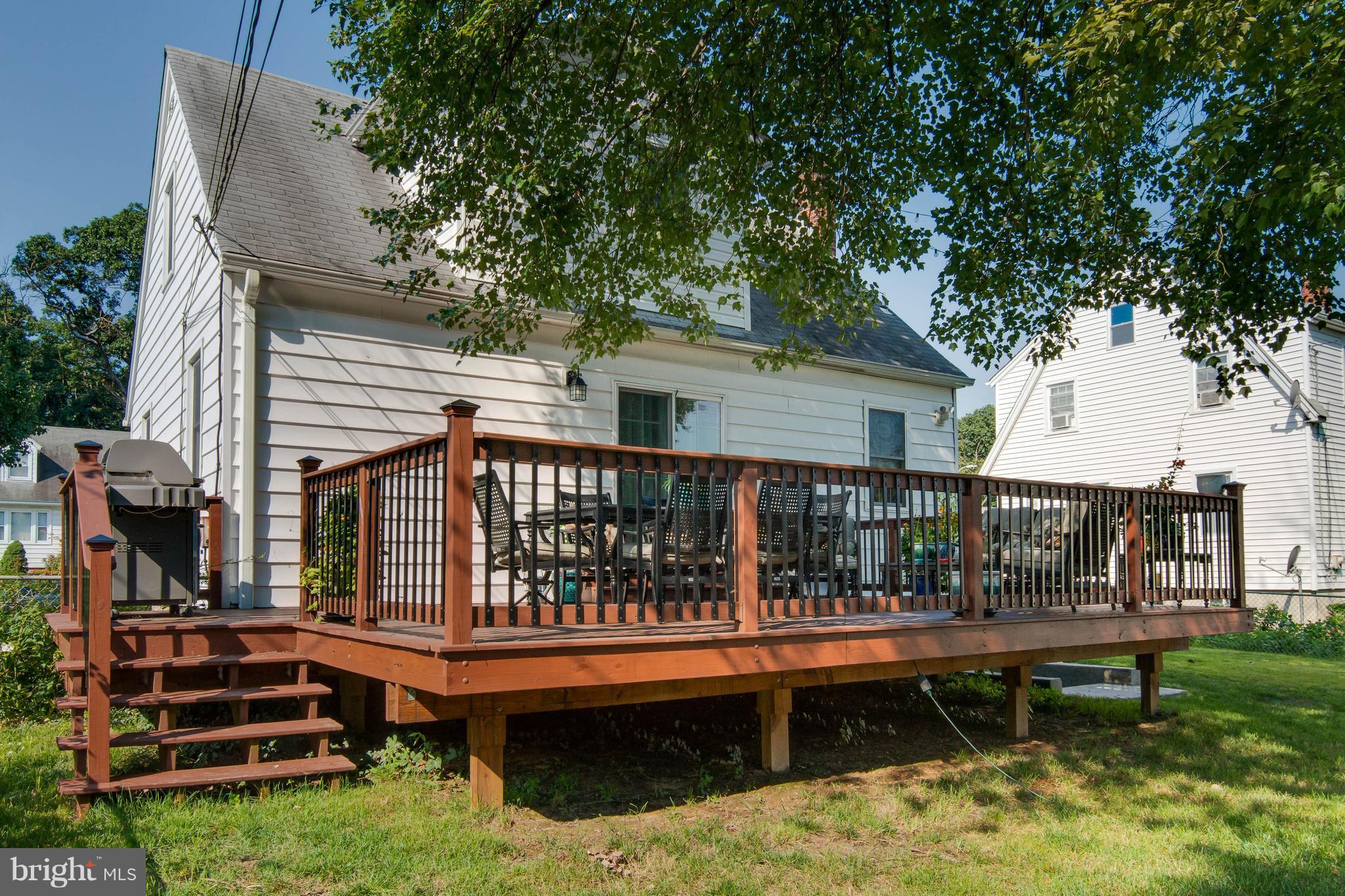 1234 Oakland Terrace Road Baltimore, MD 21227 - Photo 27 of 30 a view of a house with wooden deck and furniture