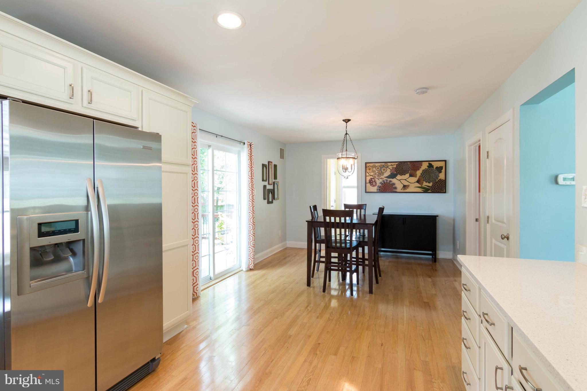 1234 Oakland Terrace Road Baltimore, MD 21227 - Photo 8 of 30 a dining room with furniture and wooden floor