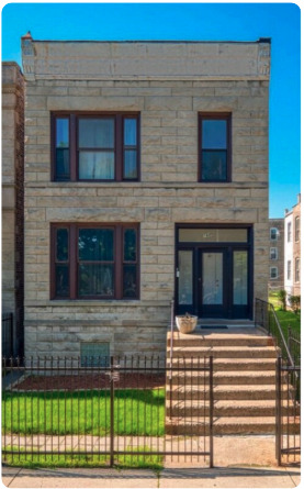 1649 West Garfield Boulevard, Unit 2 Chicago, IL 60636 - Photo 1 of 14 a front view of a house with a garden