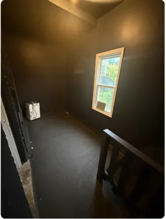 a view of an empty room and window