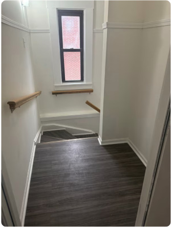 1649 West Garfield Boulevard, Unit 2 Chicago, IL 60636 - Photo 14 of 14 a view of an empty room with wooden floor and a window