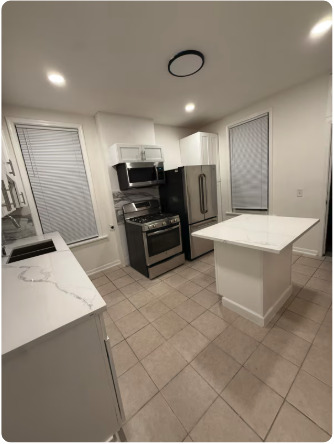 1649 West Garfield Boulevard, Unit 2 Chicago, IL 60636 - Photo 4 of 14 a large kitchen with a sink and a stove top oven