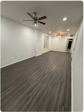 1649 West Garfield Boulevard, Unit 2 Chicago, IL 60636 - Photo 6 of 14 an empty room with wooden floor closet and fan