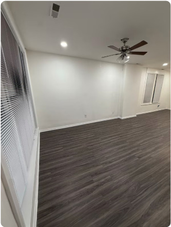 1649 West Garfield Boulevard, Unit 2 Chicago, IL 60636 - Photo 7 of 14 wooden floor in an empty room with a window