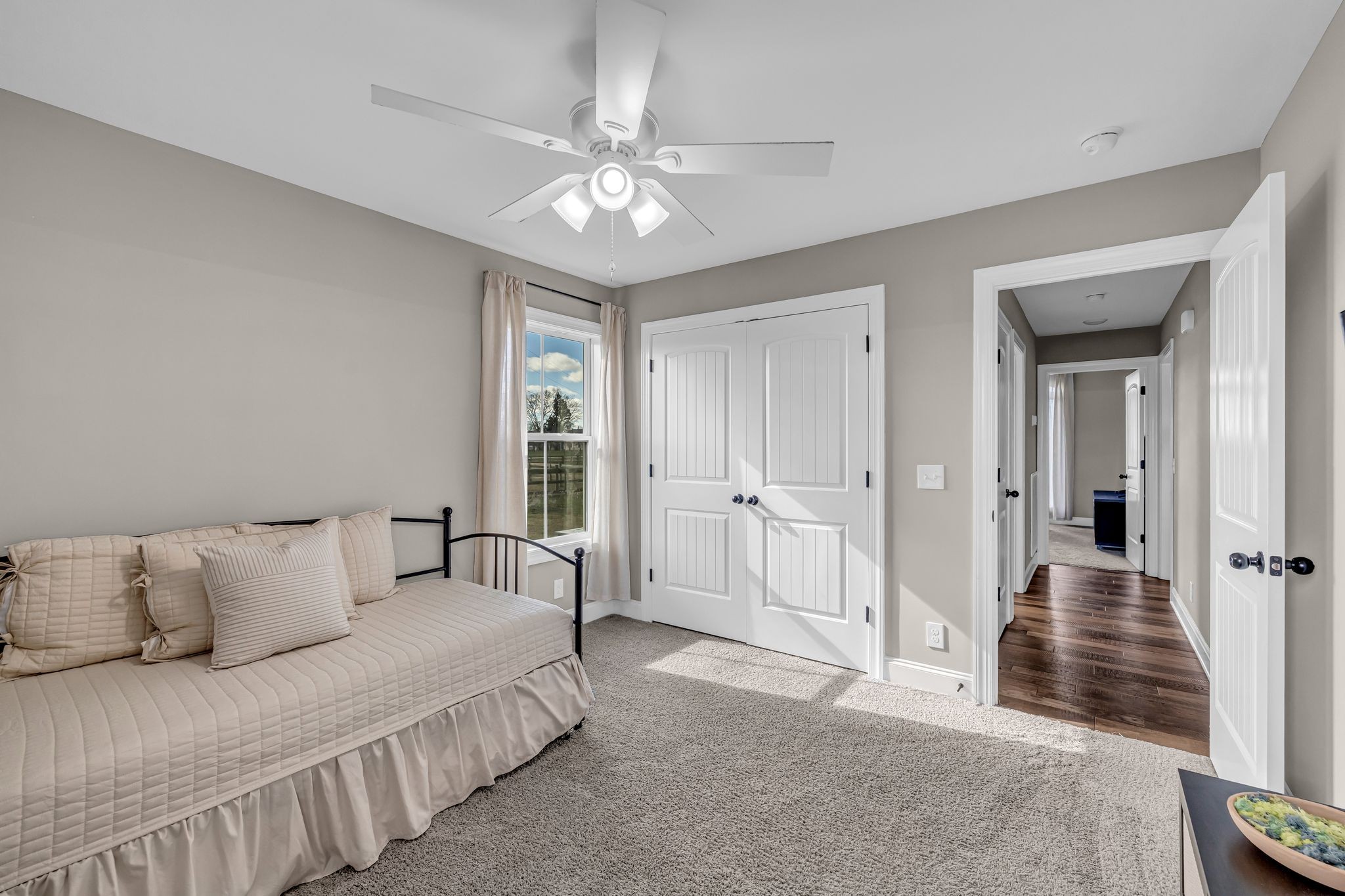 852 Longview Road Shelbyville, TN 37160 - Photo 25 of 38 a spacious bedroom with a bed and a chandelier