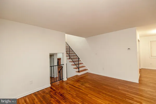 a view of entryway with wooden floor