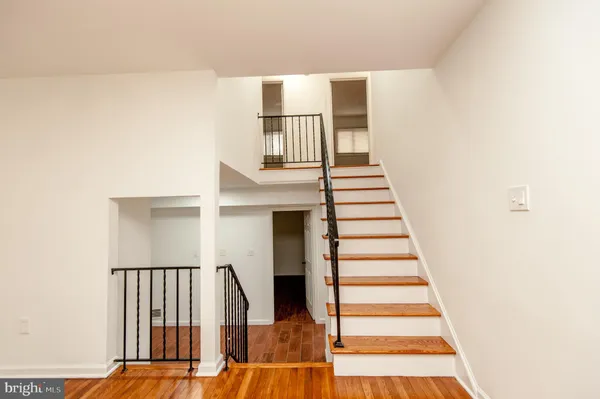 a kitchen with a stove a sink and a microwave