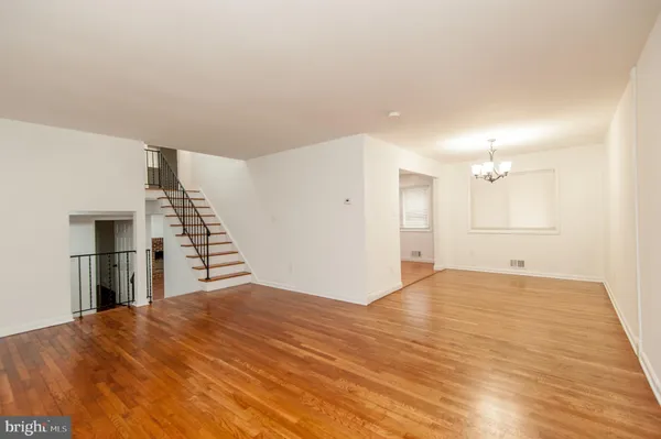a kitchen with a refrigerator stove and white cabinets
