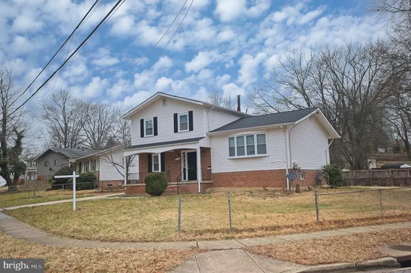 a view of a yard in front of a brick house