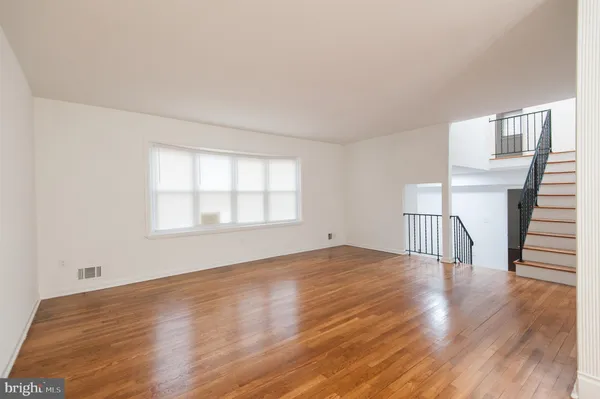a bathroom with a toilet and bathtub