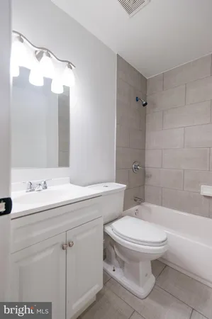 a view of a hallway with wooden floor and entryway