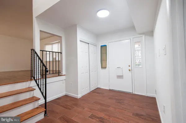 a view of an empty room with a fireplace