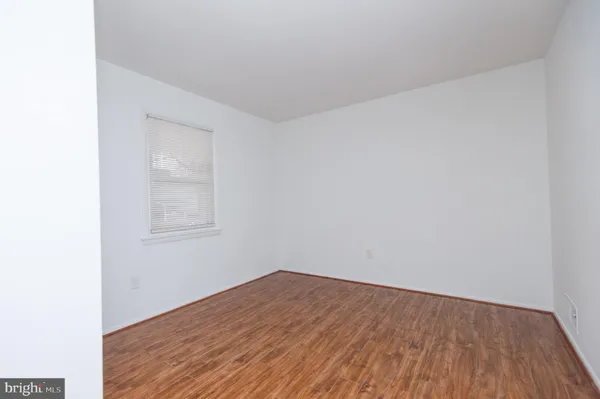 a view of a house with brick walls