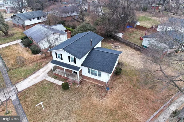 a bathroom with a bathtub shower sink vanity and toilet