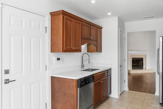 a kitchen with stainless steel appliances granite countertop a stove and a refrigerator