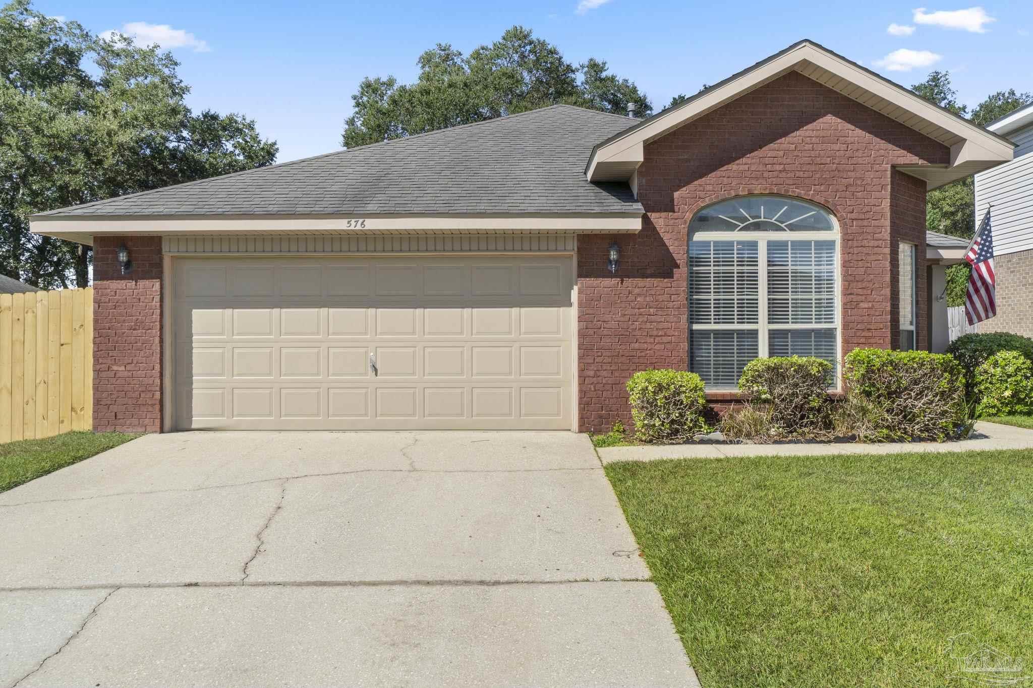 576 Edith Lane Pensacola, FL 32534 - Photo 2 of 38 a front view of a house with a yard