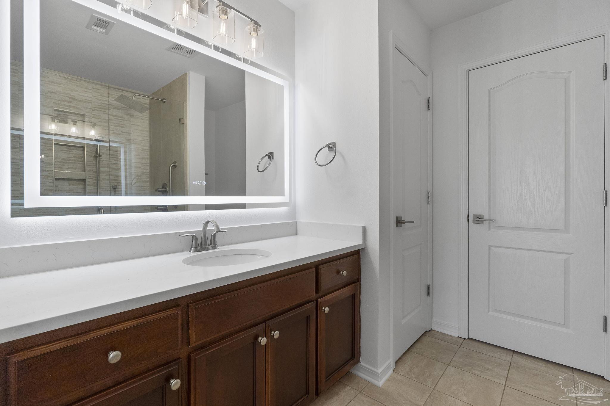 576 Edith Lane Pensacola, FL 32534 - Photo 22 of 38 a bathroom with a sink and a mirror