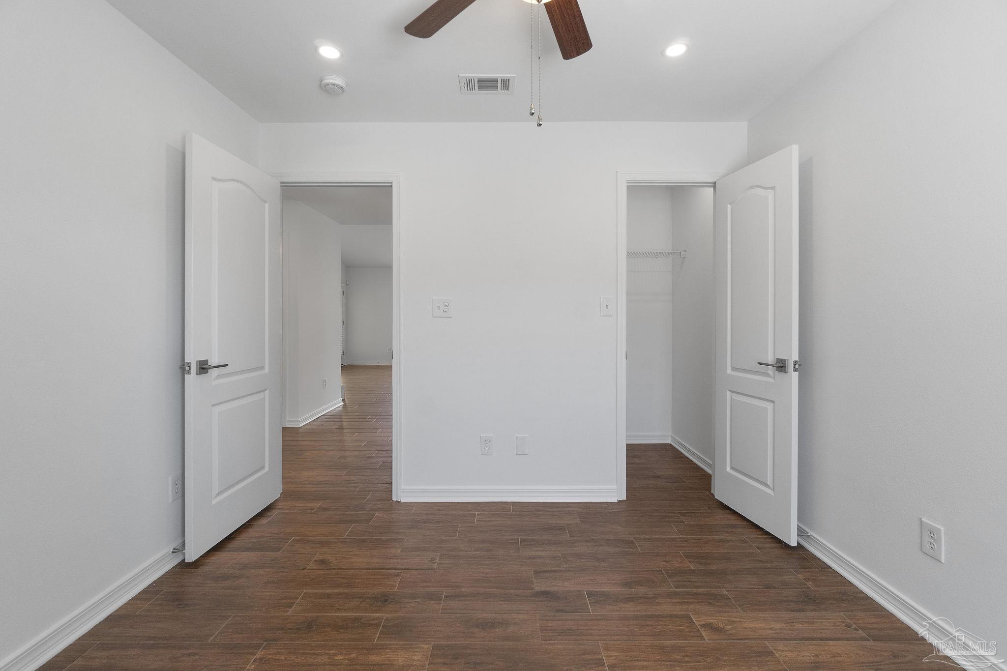576 Edith Lane Pensacola, FL 32534 - Photo 28 of 38 an empty room with wooden floor and closet