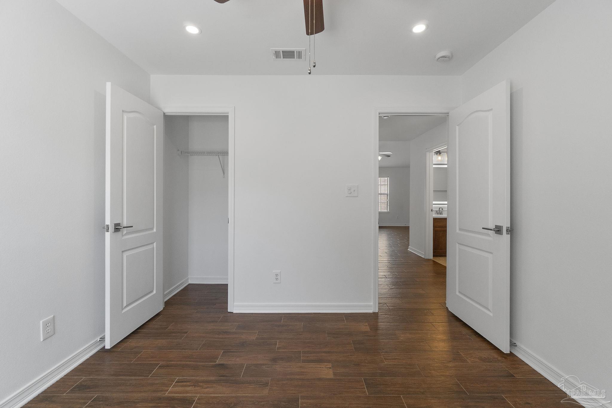 576 Edith Lane Pensacola, FL 32534 - Photo 31 of 38 a view of a hallway with wooden floor